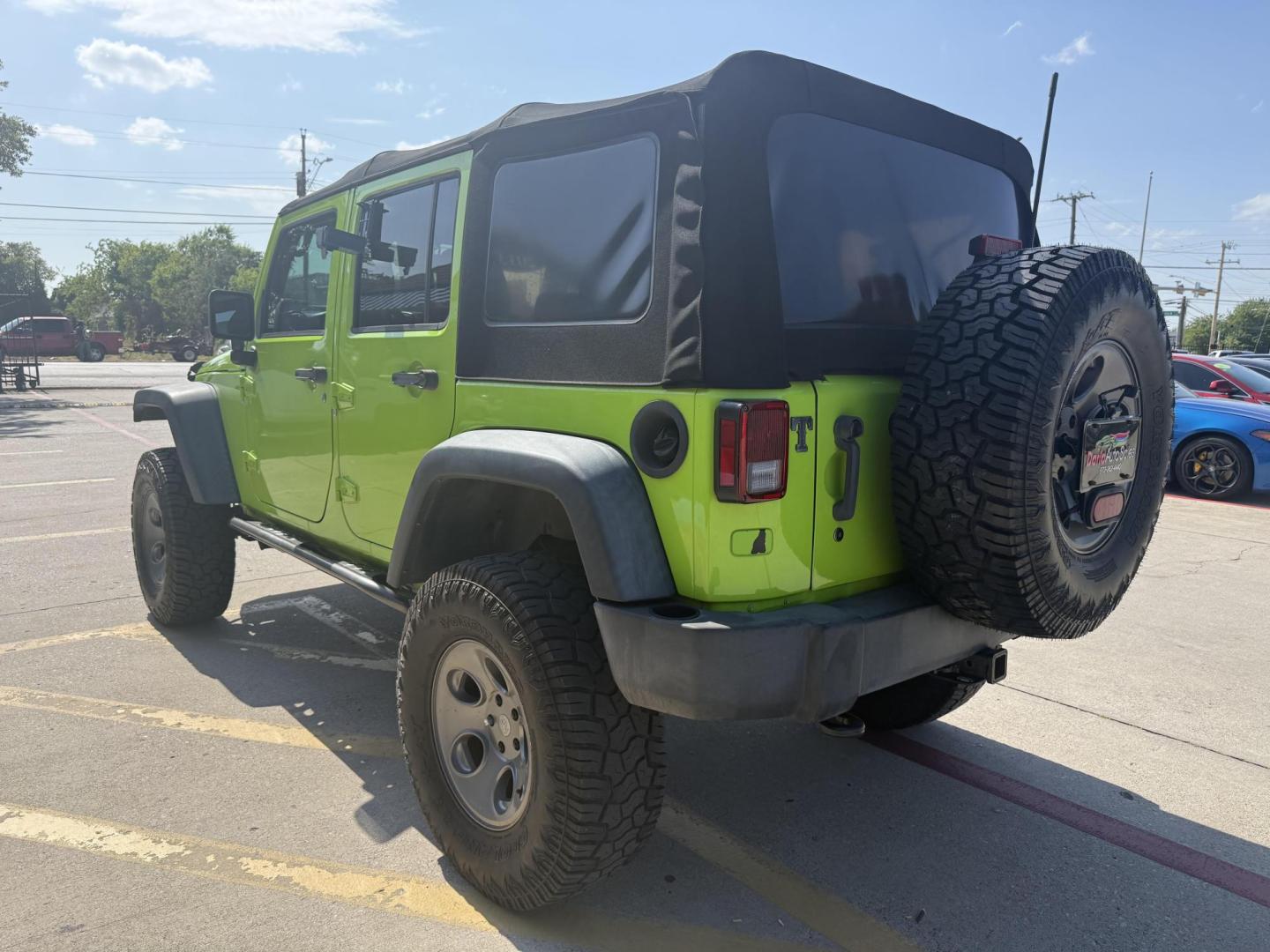 2013 Commando Green /Black Cloth Interior Black Leather Interior Black/ Jeep Wrangler 45733 (1C4BJWFG9DL) with an 3.6L V6 DOHC 24V FFV engine, 5-Speed Automatic6-Speed Manual transmission, located at 2401 E Main St., Grand Prairie, TX, 75050, (972) 262-4440, 32.748981, -96.969643 - Photo#14