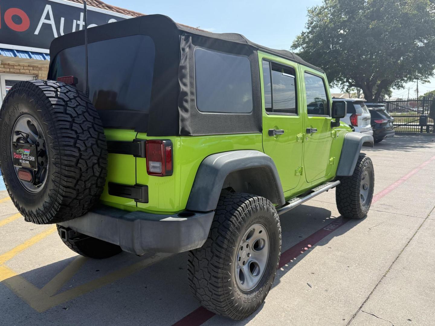 2013 Commando Green /Black Cloth Interior Black Leather Interior Black/ Jeep Wrangler 45733 (1C4BJWFG9DL) with an 3.6L V6 DOHC 24V FFV engine, 5-Speed Automatic6-Speed Manual transmission, located at 2401 E Main St., Grand Prairie, TX, 75050, (972) 262-4440, 32.748981, -96.969643 - Photo#16
