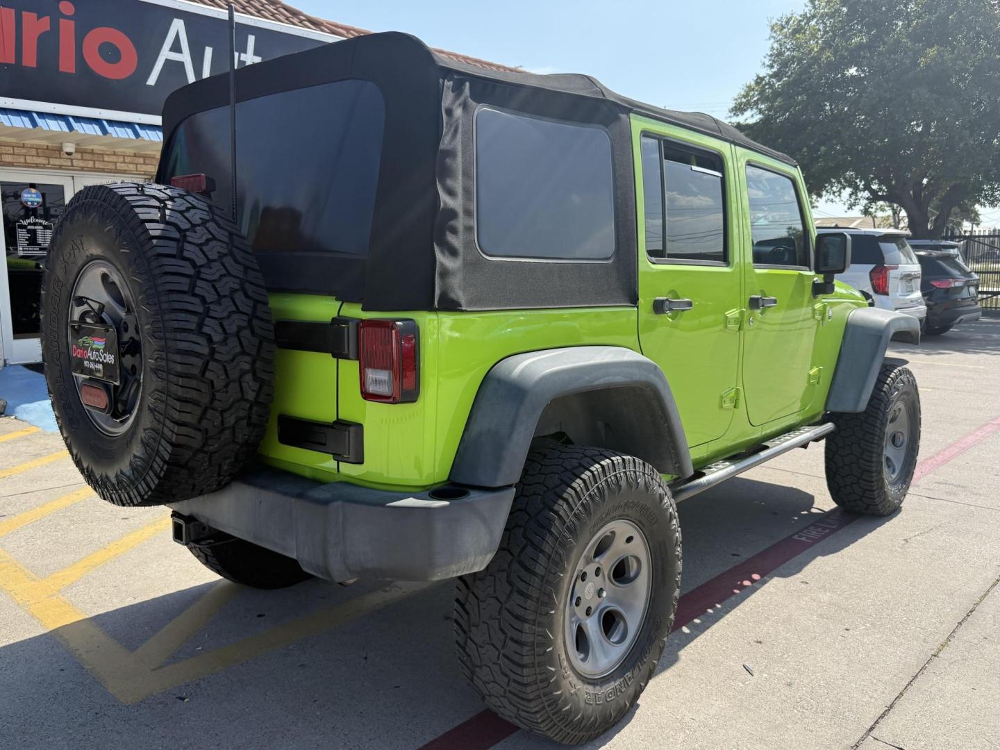 2013 Commando Green /Black Cloth Interior Black Leather Interior Black/ Jeep Wrangler 45733 (1C4BJWFG9DL) with an 3.6L V6 DOHC 24V FFV engine, 5-Speed Automatic6-Speed Manual transmission, located at 2401 E Main St., Grand Prairie, TX, 75050, (972) 262-4440, 32.748981, -96.969643 - Photo#18