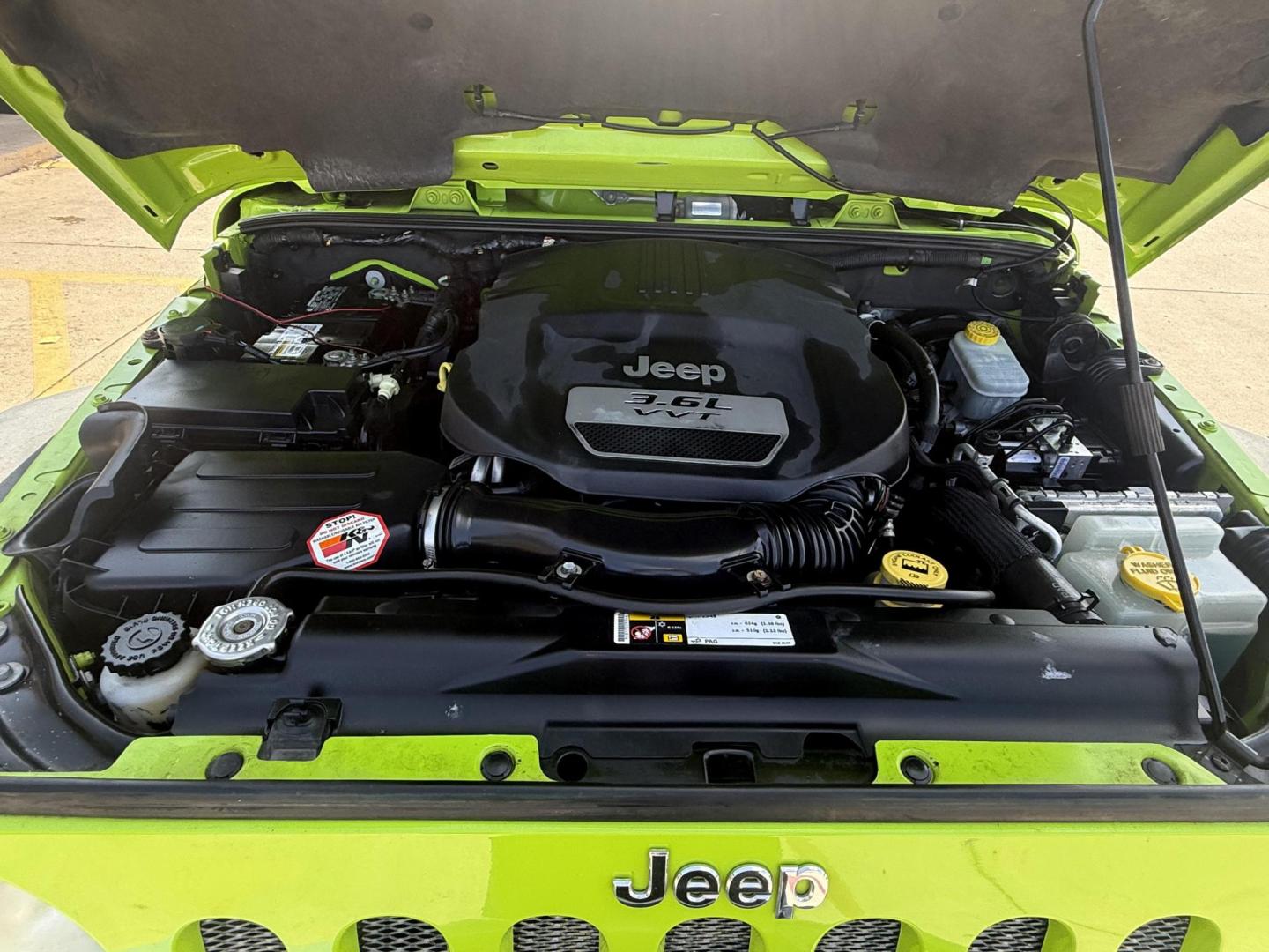 2013 Commando Green /Black Cloth Interior Black Leather Interior Black/ Jeep Wrangler 45733 (1C4BJWFG9DL) with an 3.6L V6 DOHC 24V FFV engine, 5-Speed Automatic6-Speed Manual transmission, located at 2401 E Main St., Grand Prairie, TX, 75050, (972) 262-4440, 32.748981, -96.969643 - Photo#23