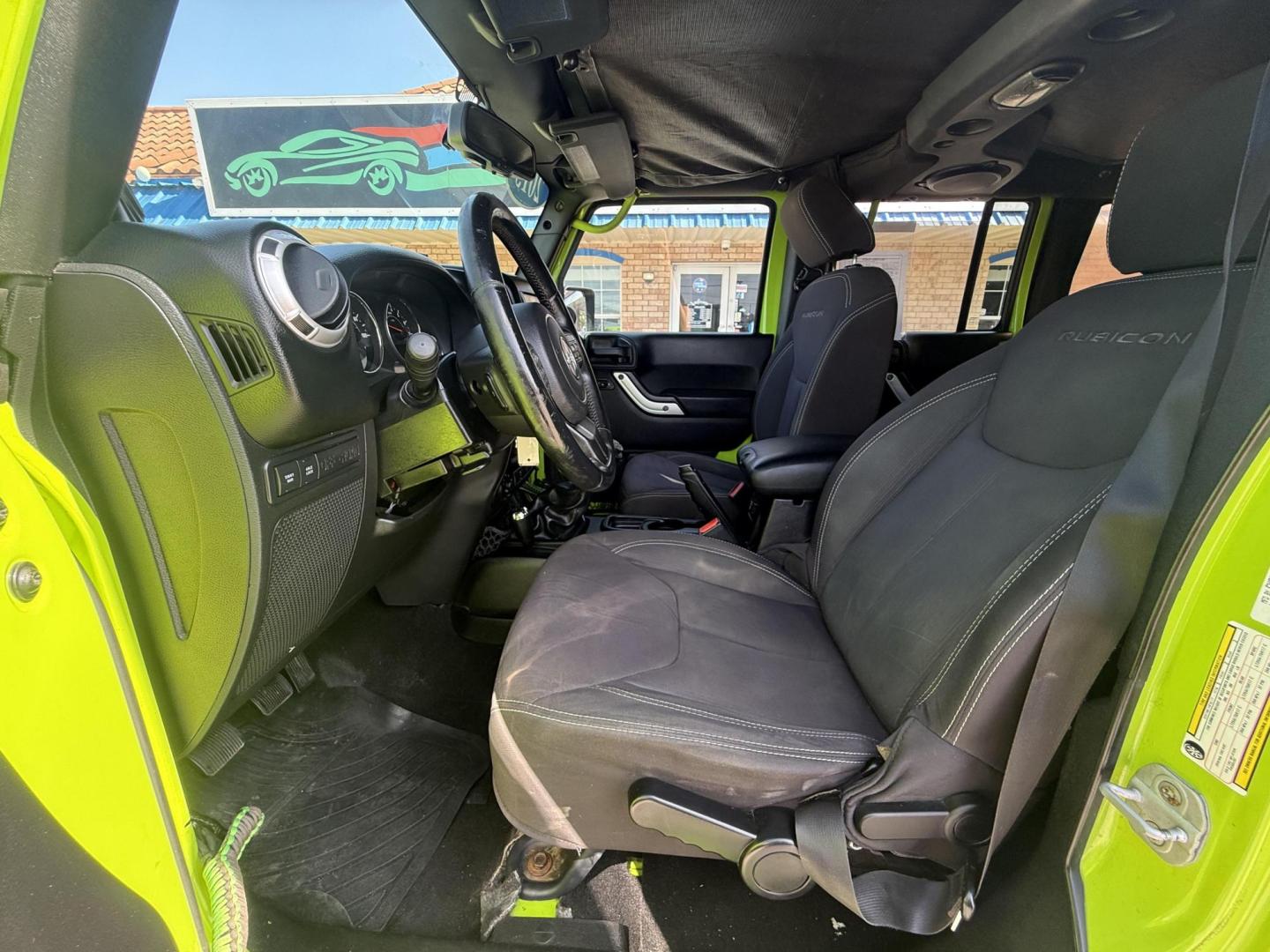 2013 Commando Green /Black Cloth Interior Black Leather Interior Black/ Jeep Wrangler 45733 (1C4BJWFG9DL) with an 3.6L V6 DOHC 24V FFV engine, 5-Speed Automatic6-Speed Manual transmission, located at 2401 E Main St., Grand Prairie, TX, 75050, (972) 262-4440, 32.748981, -96.969643 - Photo#24